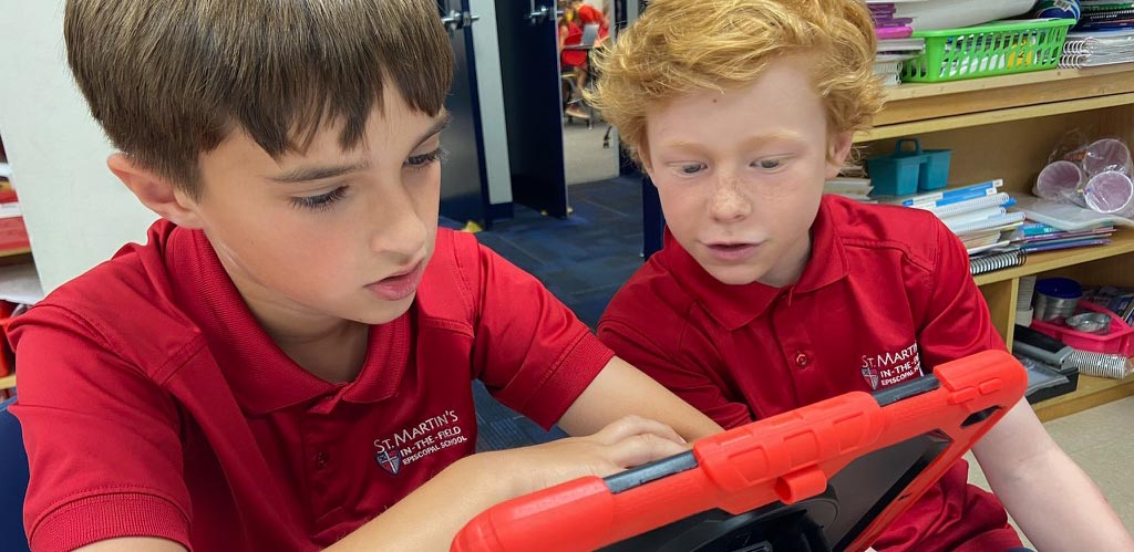 student using computer at St. Martins school